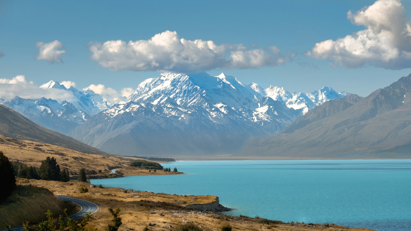 Turquoise Lake Pukaki with snow-capped Aoraki Mount Cook behind - campervan road trip New Zealand